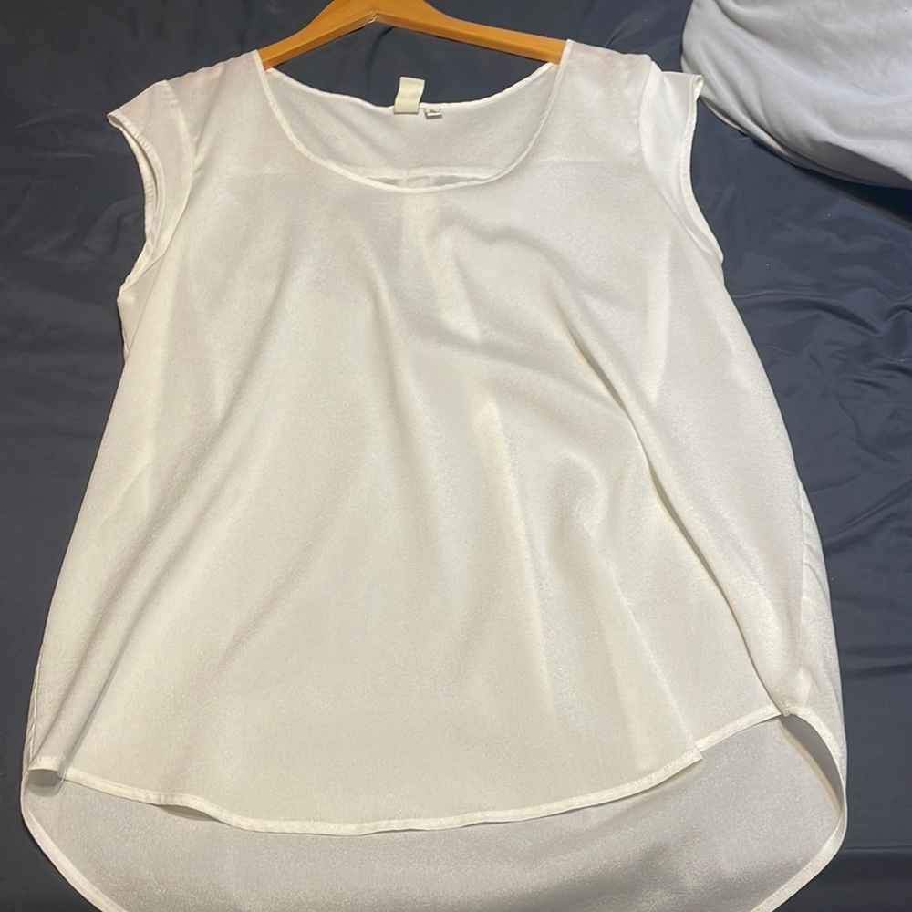 White shirt. Great for casual outings, light fit..business ready as well